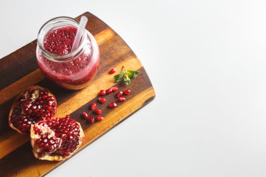 freshly prepared smoothies from banana and pomegranate. Diet, a healthy lifestyle photo