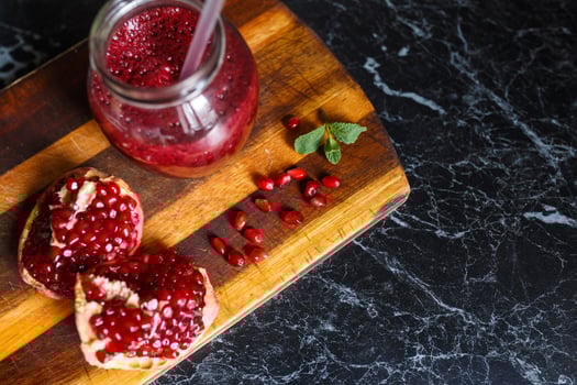 freshly prepared smoothies from banana and pomegranate. Diet, a healthy lifestyle photo