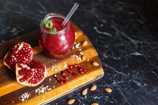 freshly prepared smoothies from banana and pomegranate. Diet, a healthy lifestyle photo