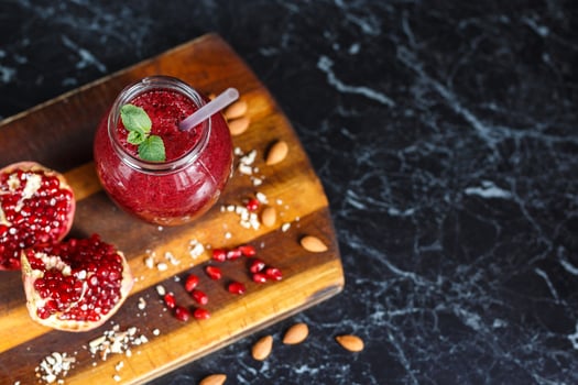 freshly prepared smoothies from banana and pomegranate. Diet, a healthy lifestyle photo