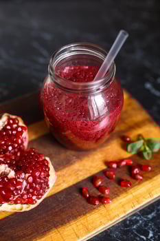 freshly prepared smoothies from banana and pomegranate. Diet, a healthy lifestyle photo