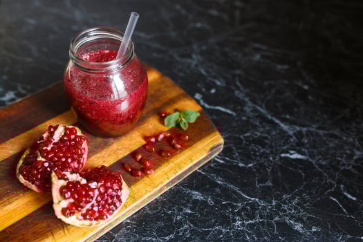 freshly prepared smoothies from banana and pomegranate. Diet, a healthy lifestyle photo