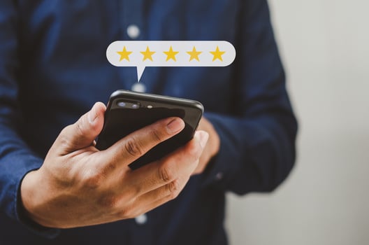Customer service concept excellent service for satisfaction five star rating with business man holding smart phone. photo