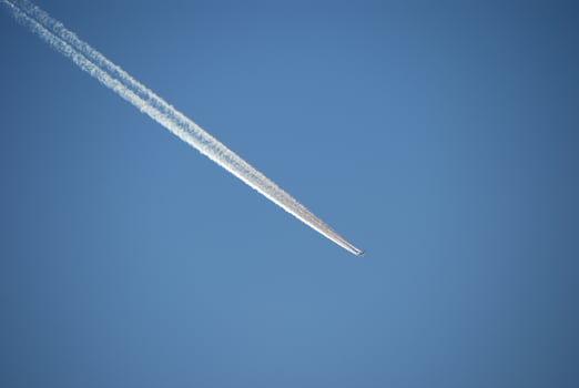 aircraft with vapor trail photo