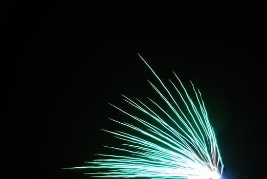 near green explosion at a fireworks in the night of new year photo