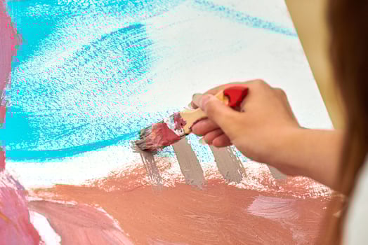 Amateur painter drawing picture on white canvas at outdoor art exercise, painting performance photo