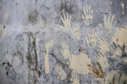 Hand print on cement wall for protest concept background photo