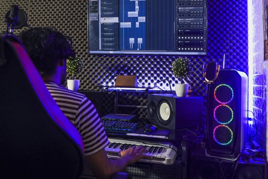Pianist playing piano and recording in the  studio photo