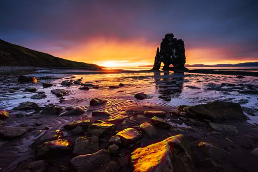Hvitserkur 15 m height. Is a spectacular rock in the sea on the Northern coast of Iceland.  this photo  reflects in the  water after the midnight sunset.