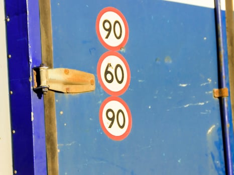 eight speed restriction sign on red corrugated background photo