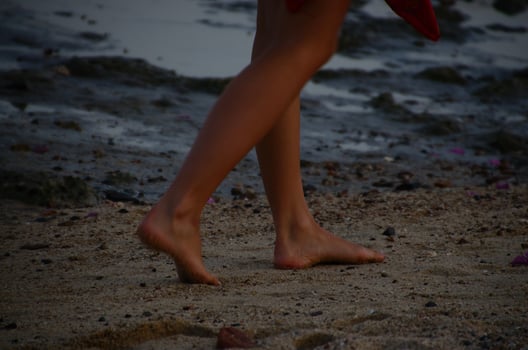 feet of a woman on sand photo