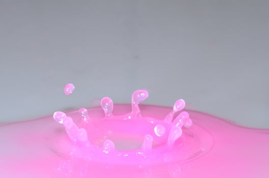 small drops in pink liquid photo