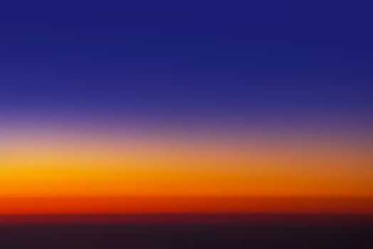 Sunset sky from the airplane window at height 35,000 feet. photo