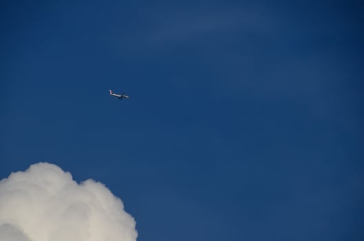 passenger plane in the blue sky photo