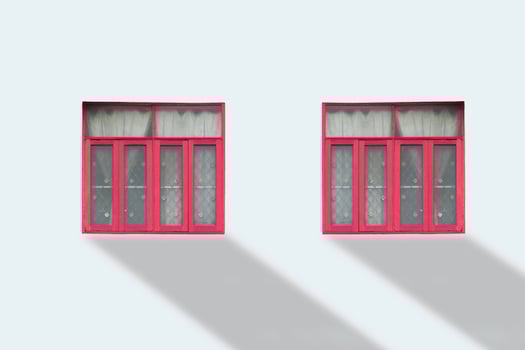 Front view of colorful window on white wall. photo