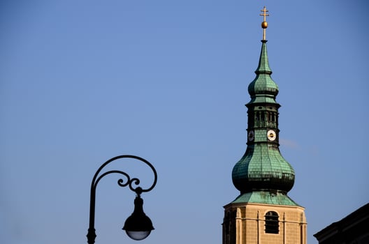 church tower with old streetlamp photo