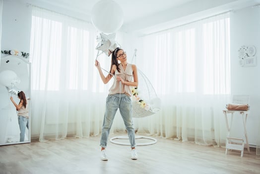 Fashion photo beautiful woman with balloons. Girl posing. photo studio