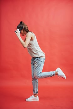 Young attractive Japanese woman using VR-glasses headset photo