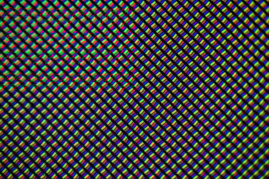 Light photomicrograph of a mobile LCD screen seen through a microscope photo