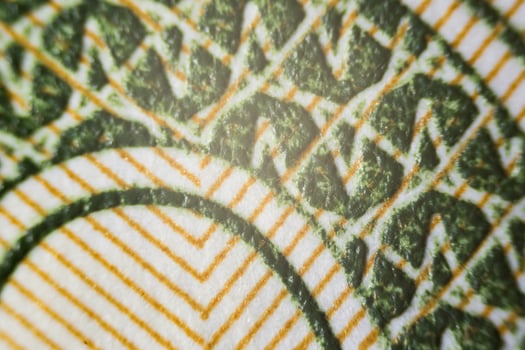 USA money under a microscope partially out of focus, focus point on center photo