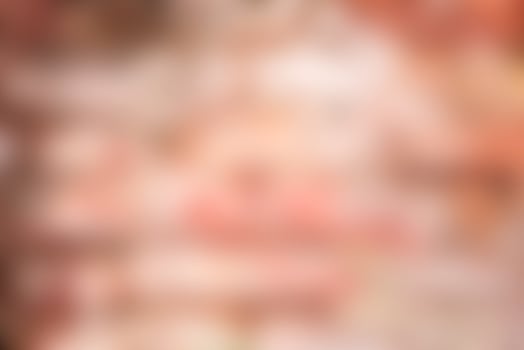 Texture of a brick wall with cracks and scratches which can be used as a background photo