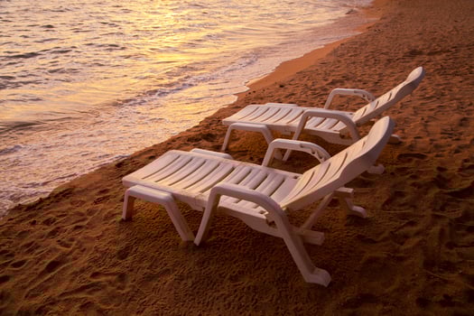 sunset over sea Pataya beach Thailand with beach chair photo