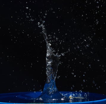 water splashes, isolated on a black background photo