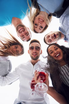 summer vacation, happy people - a group of teenagers looking down with a happy smile on his face. photo