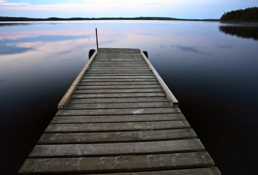Boat dock at Smallfish Lake in scenic Saskatchewan photo