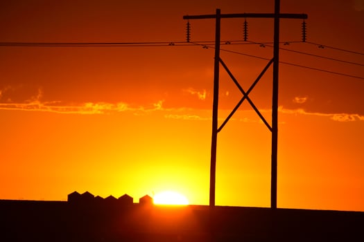 Gorgeous sunset behind Saskatchewan power towers photo