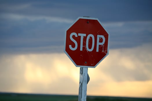 Storm clouds building behind a Stop sign in Saskatchewan photo