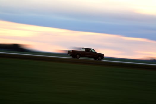 Speeding car along a Saskatchewan highway photo