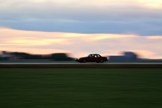 Speeding car along a Saskatchewan highway photo