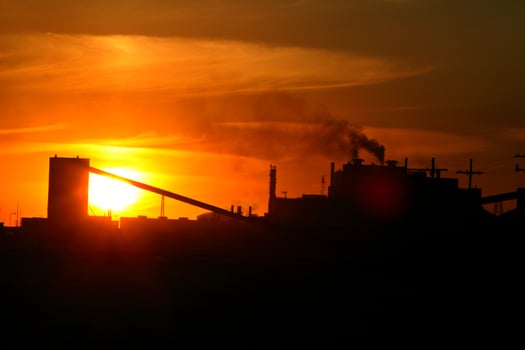 Sun setting behind Mosaic Potash Mine in Saskatchewan photo