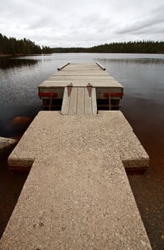 Boat dock on Northern Manitoba lake photo