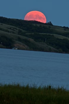 Full moon over Buffalo Pound Lake photo