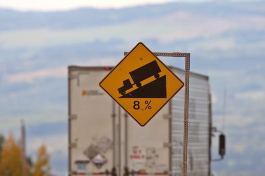Semi trailer approaching steep grade photo