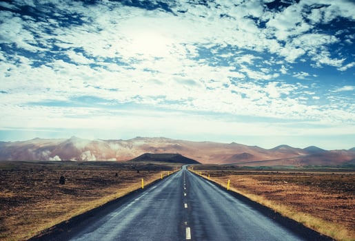 Road in mountains. Bridge over a channel connecting Jokulsarlon Lagoon and Atlantic Ocean in southern Iceland photo