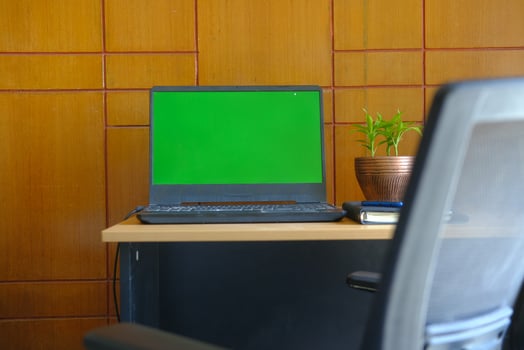laptop with blank screen on office desk. photo