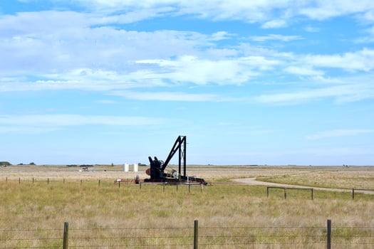 old oil pump on the prairies photo