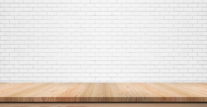 Empty wooden table top, counter or shelf on white brick wall background, For food display banner, backdrop. photo