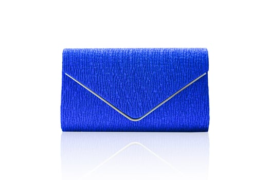 Blue clutch bag isolated on white background with clipping path. photo