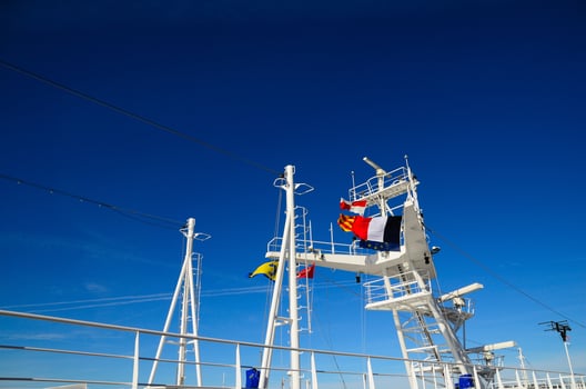 colorful flags on a cruise ship photo