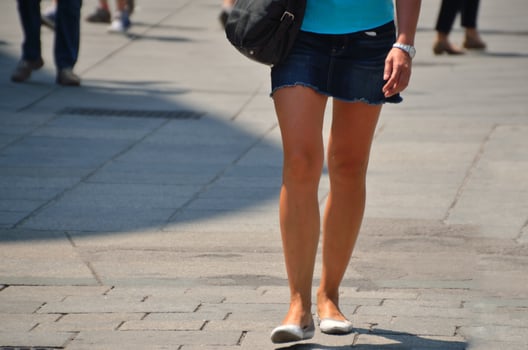 woman in short jeans skirt photo