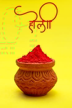 Indian festival Holi concept colour bowl with colorful background and writing holi in marathi calligraphy. photo