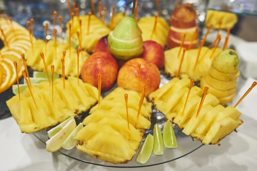The vases with fruits stand on the buffet table photo