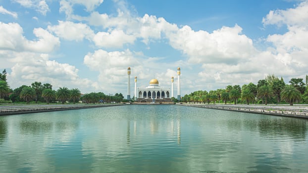 Songkhla Central Mosque with blue sky and cloud over the mosque . Largest Mosque in Thailand photo