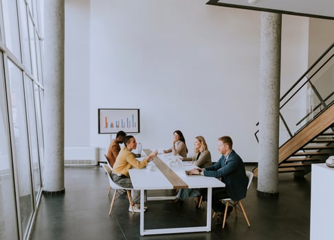 Group of multiethnic business people working together and preparing new project on a meeting in office photo