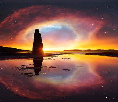 starry sky in a spectacular rock in the sea on the Northern coast of Iceland. Legends say it is a petrified troll. photo
