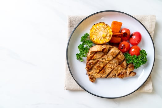 grilled and barbecue fillet pork steak with vegetable photo